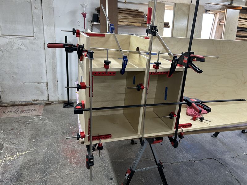 Locker carcass standing in clamps during assembly